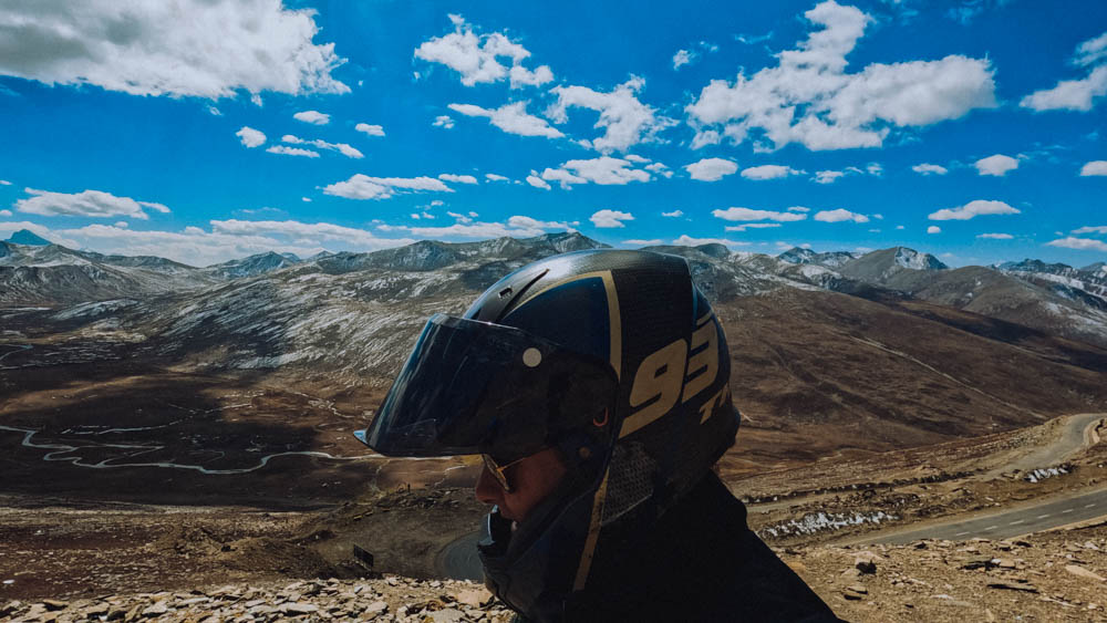 a solo-female traveller on a motorbike in the mountains of Babusar Top in Pakistan