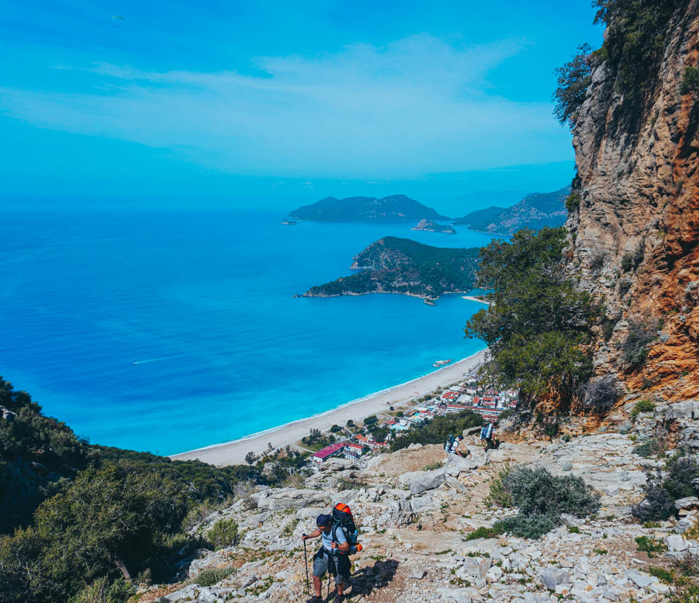 Backpacking hiker trekking up Babadag Mountain on the Lycian Way in Fethiye, Turkey