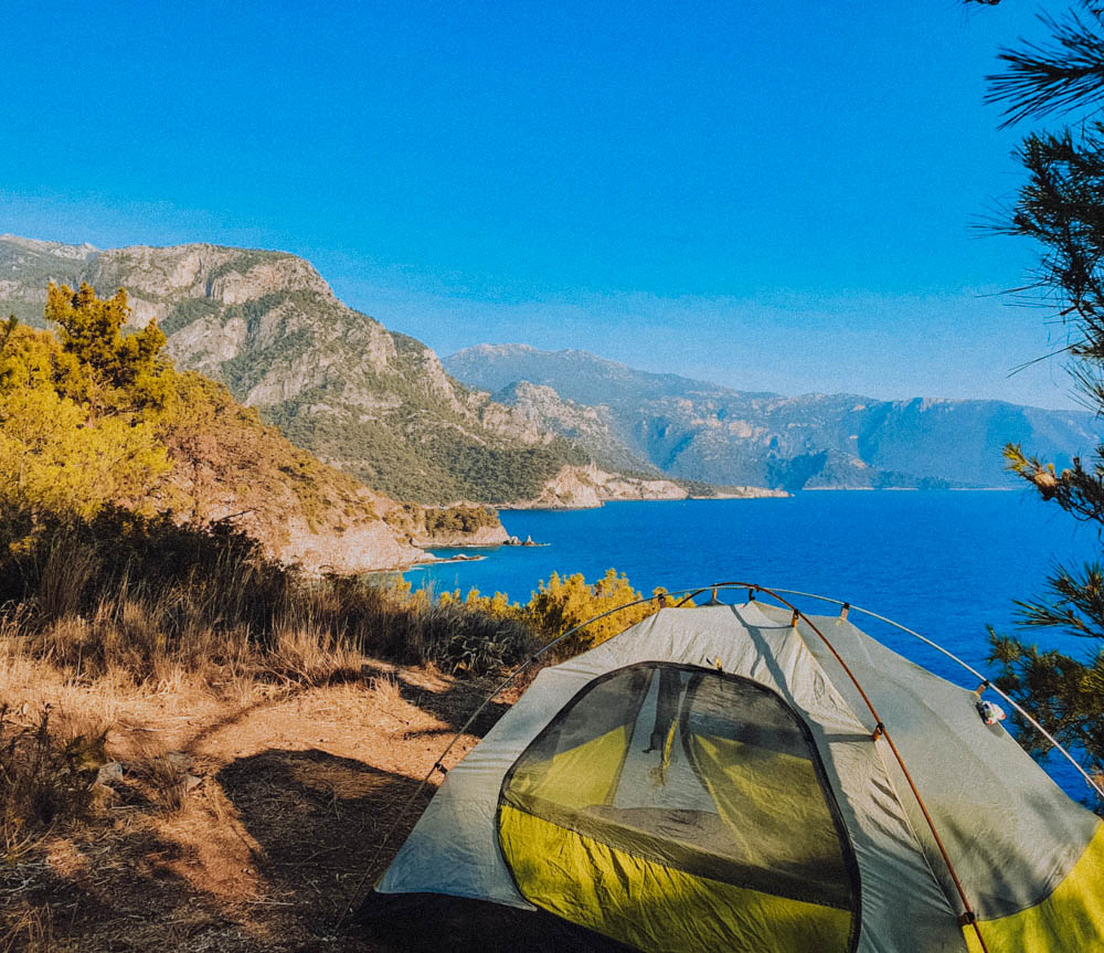 A Lycian Way hikers tent set up on a cliffside overlooking the Mediterranean Sea 