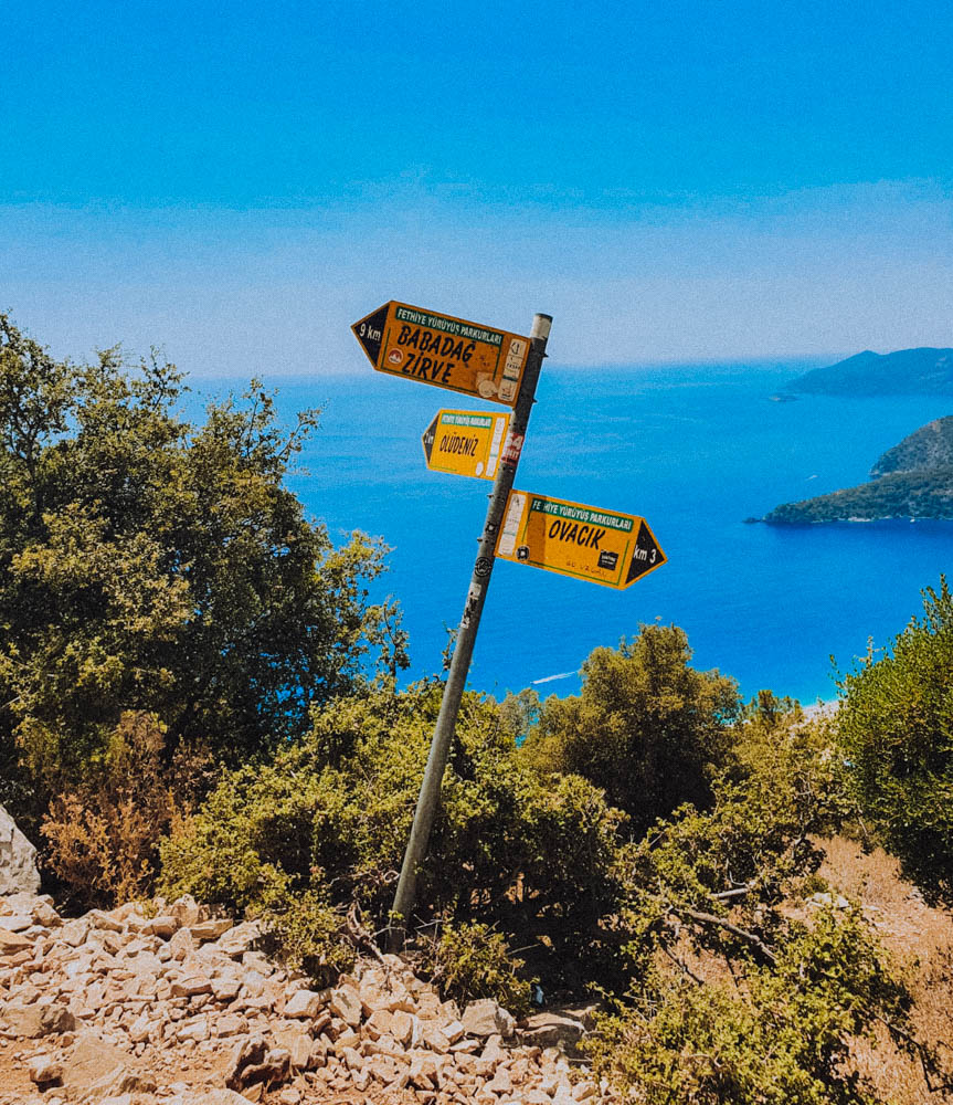 A sign on the Lycian Way showing the route to Babadag to the left and the route to Ovacik on the right. 