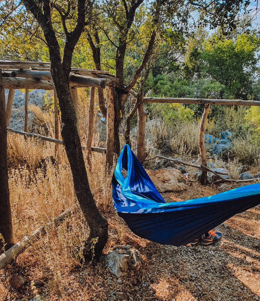 A hiker relaxing in a hammock on the Lycian Way. 