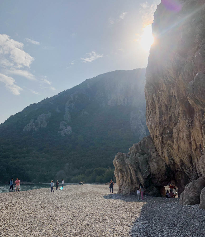 Tourists walking Olympos Beach on the Lycian Way