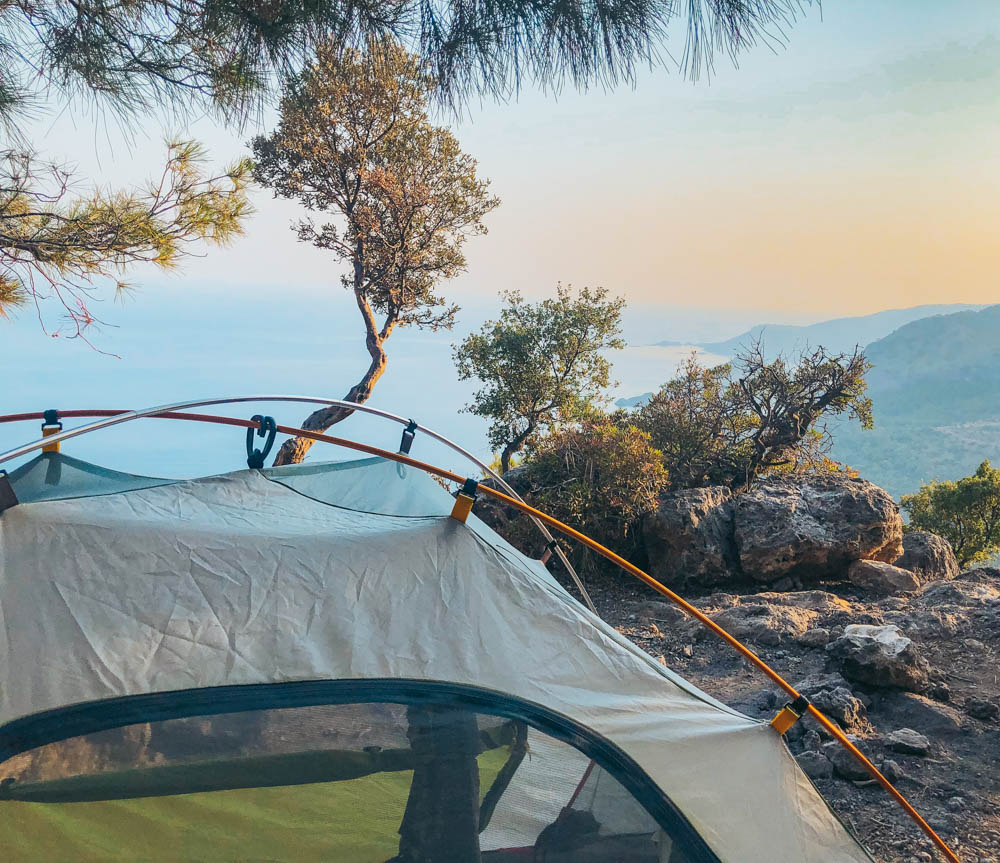 A Lycian Way hikers tent is setup on the trail overlooking the Mediterranean Sea. 