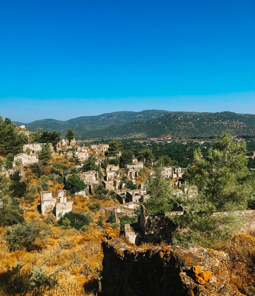 A view of the ruins of the ancient city of Kayakoy as seen from the Lycian Way trail in Fethiye, Turkey. 