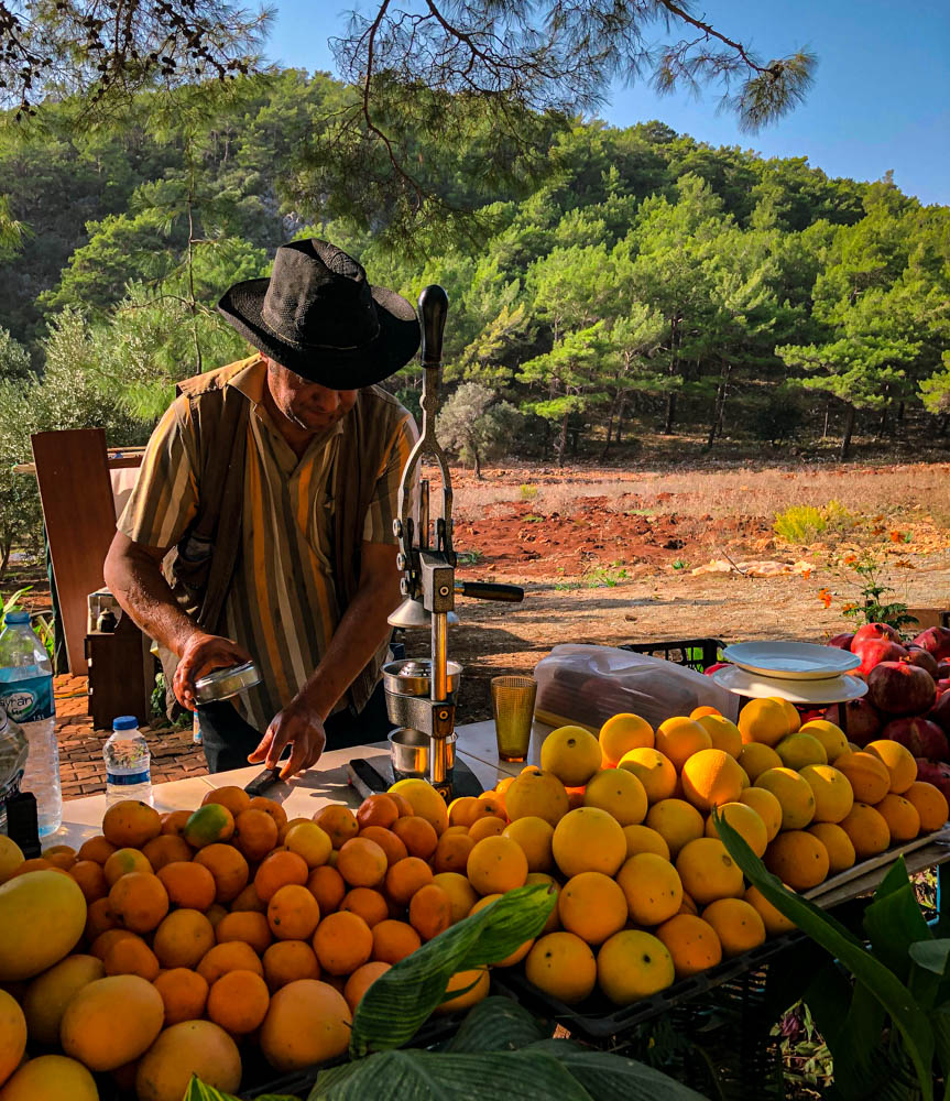 A villager squeezing fresh juice on the Lycian Way trail in the village of Korsan Bay. 