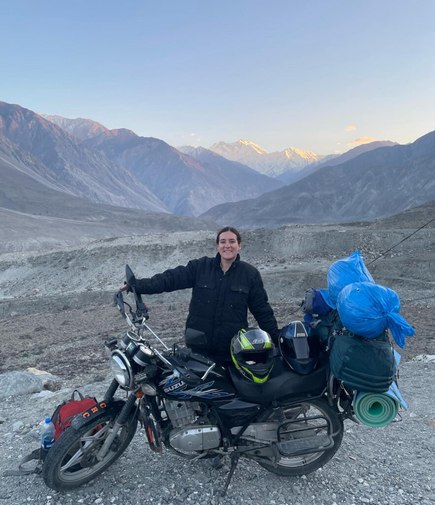 A biker standing in front of Nanga Parbat Viewpoint in Pakistan
